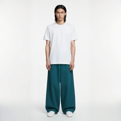 Men’s teal baggy sweatpants with oversized fit and relaxed silhouette
